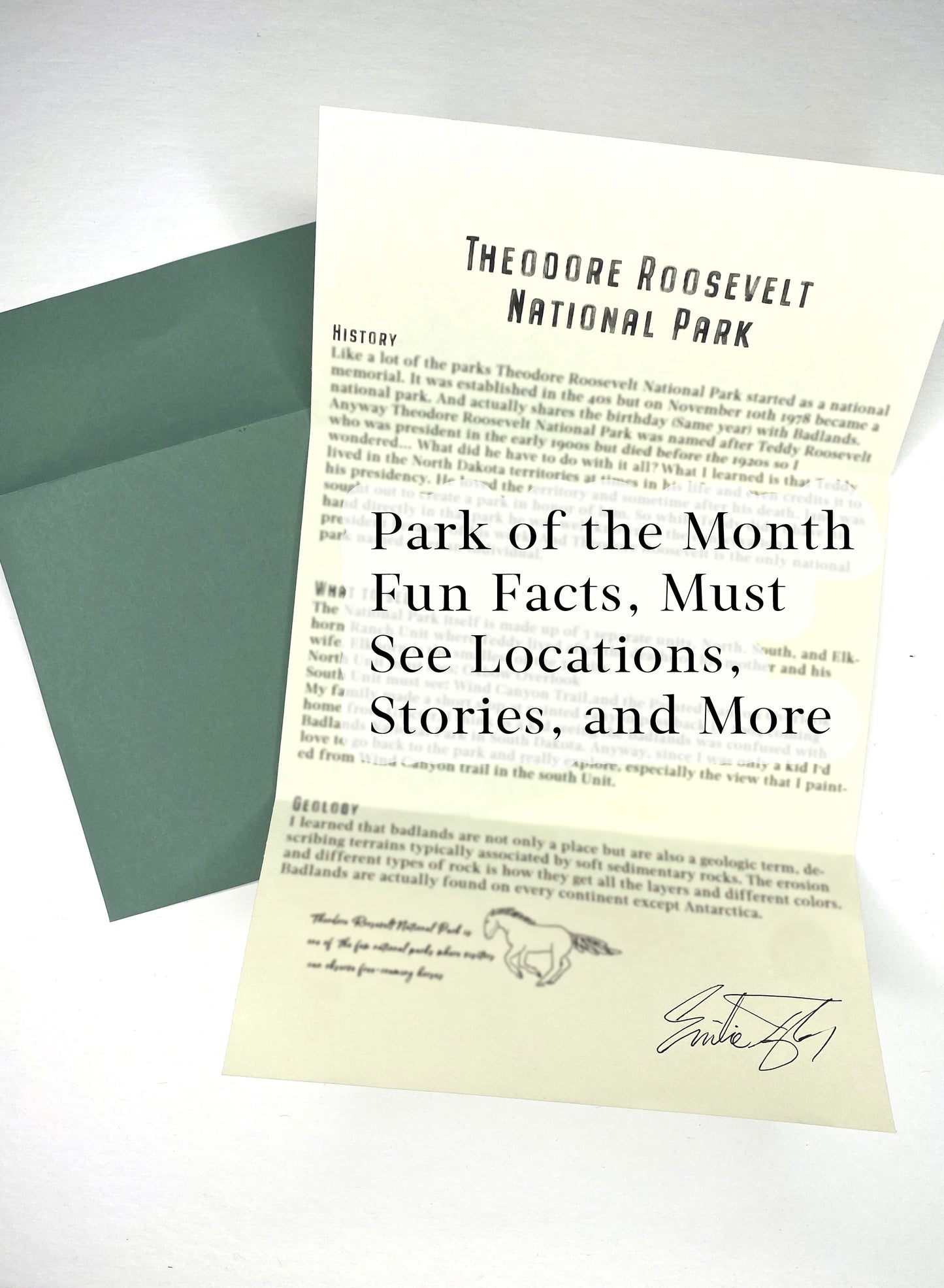 Sheet of paper with text about Theodore Roosevelt National Park, featuring a green envelope.