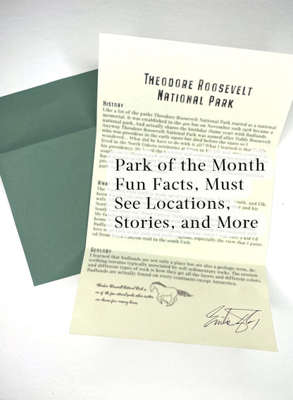 Sheet of paper with text about Theodore Roosevelt National Park, featuring a green envelope.